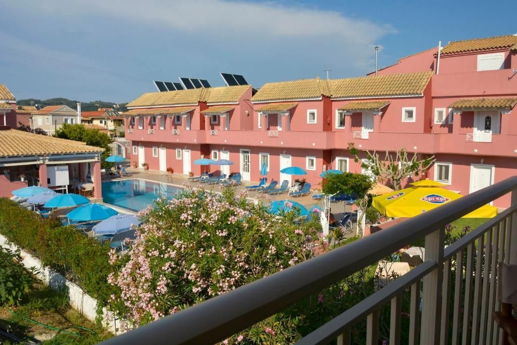 View over the shared pool and the apartments on the property